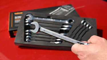 Auto Express products editor Tom Barnard holding a Halfords Advanced spanner